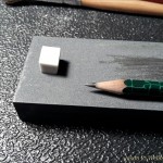 Jason's pencil and sharpening stone. Jason uses a mechanical pencil and sharpens the graphite of a 0.3mm lead for precision