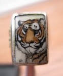 Tiger ring with the initials HM or HN in the lower left hand Corner - Mystery Artist #11