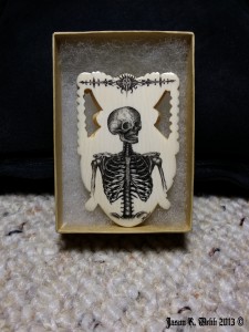 Skeleton by Jason R Webb with addtion of embellishment on the top.