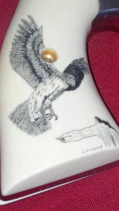 Scrimshaw Pistol Grip by R. Heinrich with Falcon in flight