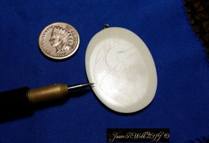 Coin and scrimshawed cabochon with Jason's scribing tool