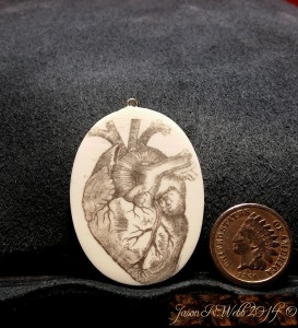 Penciled in heart on ivory cabochon to the left, coin to the right for scale.