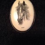 Horse portrait on oval cabochon with the name KNIGHT in block letters