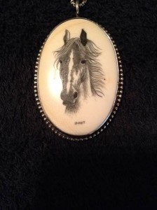 Horse portrait on oval cabochon with the name KNIGHT in block letters