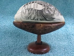 Scrimshaw of a tiger on a wood base by Rod Lacey