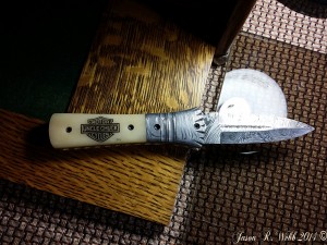 Top view of the Damacus folder with custom scrimshaw by Jason R. Webb