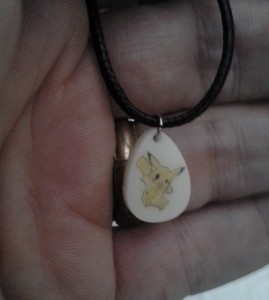 Picachu scrimshaw on acrylic teardrop