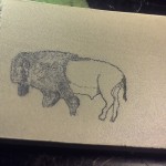 Buffalo scrimshaw on paper micarta in progress
