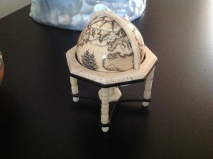 Scrimshaw globe by Al Douchette in it's stand