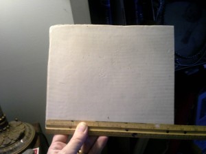 quarter sheet of casein with ruler at the bottom.