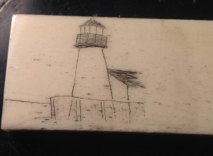Lighthouse scrimmed into bone and stained with India ink