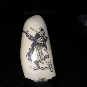 Pirate scrimshawed on a whale tooth