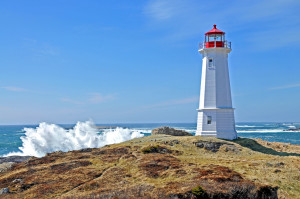 Lighthouse with waves crashing to the left