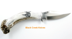 Antler handle with scrimshaw on knife