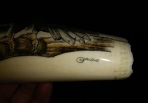 Signature on the bottom of the eagle head scrimshaw and sculpture - "Andhi"