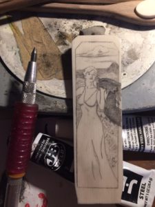 Lady and Dragon scrimshawed into alt. ivory for a letter opener