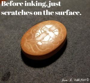 Before inking, just scratches on the surface of a cabochon