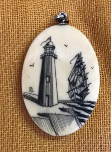 Scrimshaw Cabochon with initials "PL" of a lighthouse and ship